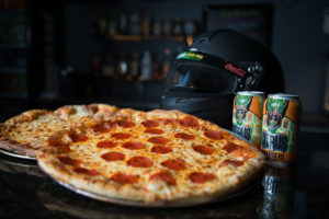 graduation party food with pepperoni pizza and canned beer