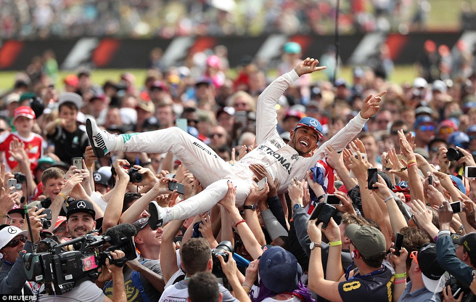 Formula 1 racer Lewis Hamilton wins the British grand prix at Silverstone circuit for fifth time